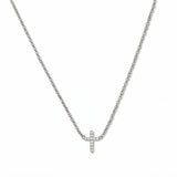 An Endless Faith Mini Cross with White Cubic Zirconia Necklace by Skōsh Jewelry, featuring a petite cross lined with small clear stones set on a fine sterling silver chain, displayed against a white background.