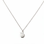 An Apple Pendant Necklace by Skōsh Jewelry, featuring a small polished apple pendant with a leaf on a fine sterling silver chain, displayed against a white background.