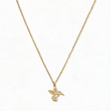A Hummingbird Pendant Necklace by Skōsh Jewelry, featuring a small hummingbird in flight on a fine gold chain, displayed against a white background.