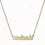 A Cardinals Gameday Necklace by Skōsh Jewelry, featuring the word 'cardinals' in script letters set horizontally on a fine gold chain, displayed against a white background.