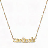 A Cardinals Gameday Necklace by Skōsh Jewelry, featuring the word 'cardinals' in script letters set horizontally on a fine gold chain, displayed against a white background.