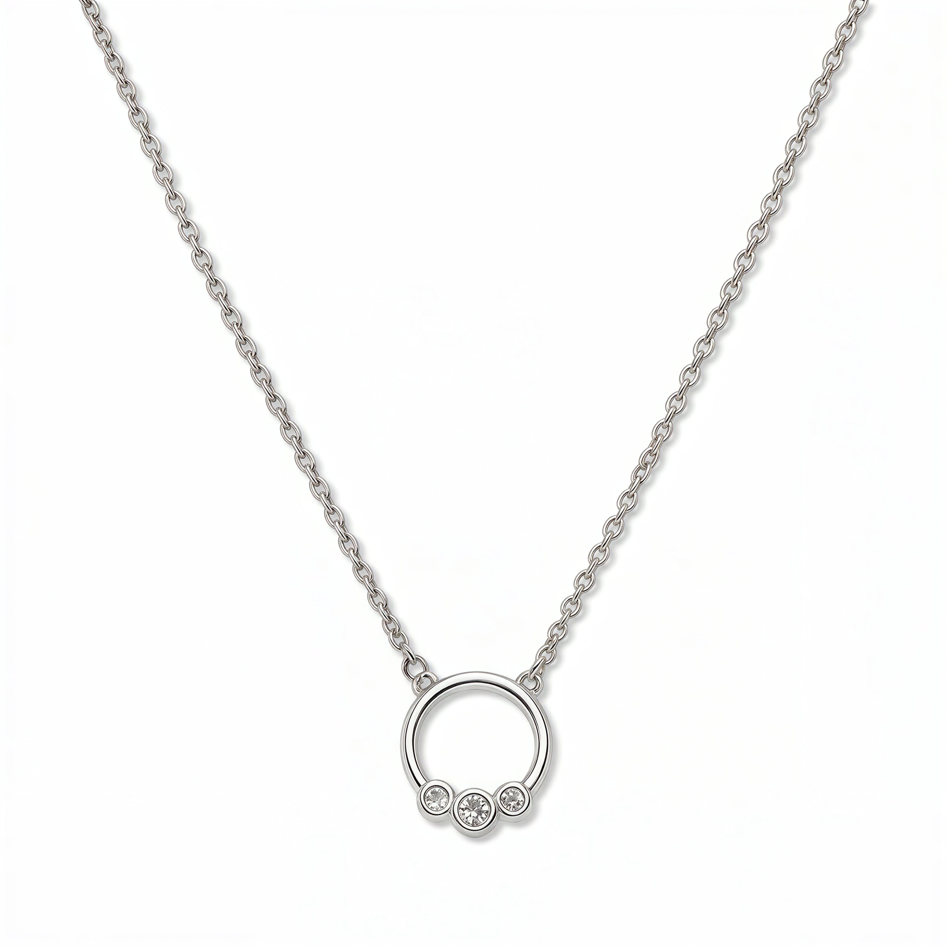 A Trio White Cubic Zirconia Accent Circle Necklace by Skōsh Jewelry, featuring a small open circle accented with three clear stones on a fine sterling silver chain, displayed against a white background.