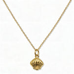 A Seashell Pendant Necklace by Skōsh Jewelry, featuring a ridged scallop seashell pendant on a fine gold chain, displayed against a white background.