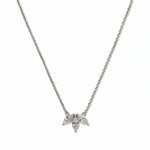A Triple Marquise Cut White Cubic Zirconia Necklace by Skōsh Jewelry, featuring three marquise-cut clear stones fanned in a row on a fine sterling silver chain, displayed against a white background.