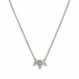 A Triple Marquise Cut White Cubic Zirconia Necklace by Skōsh Jewelry, featuring three marquise-cut clear stones fanned in a row on a fine sterling silver chain, displayed against a white background.
