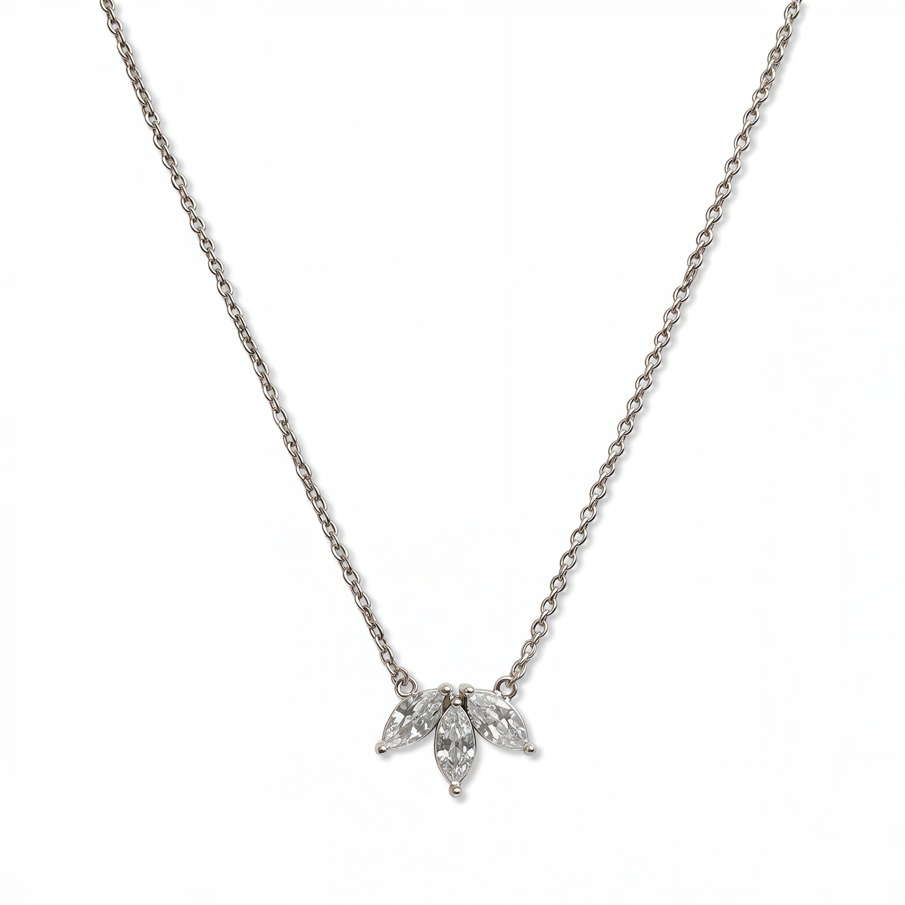 A Triple Marquise Cut White Cubic Zirconia Necklace by Skōsh Jewelry, featuring three marquise-cut clear stones fanned in a row on a fine sterling silver chain, displayed against a white background.