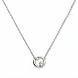 A Karma Double White Cubic Zirconia Accent Circle Necklace by Skōsh Jewelry, featuring an open circle with two clear stone accents on a fine sterling silver chain, displayed against a white background.