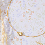 Smiley Face Necklace in 14K gold over sterling silver by Skōsh Jewelry