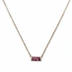 A February Birthstone Amethyst Cubic Zirconia Baguette Necklace by Skōsh Jewelry, featuring a slim rectangular purple baguette stone set horizontally on a fine sterling silver chain, displayed against a white background.