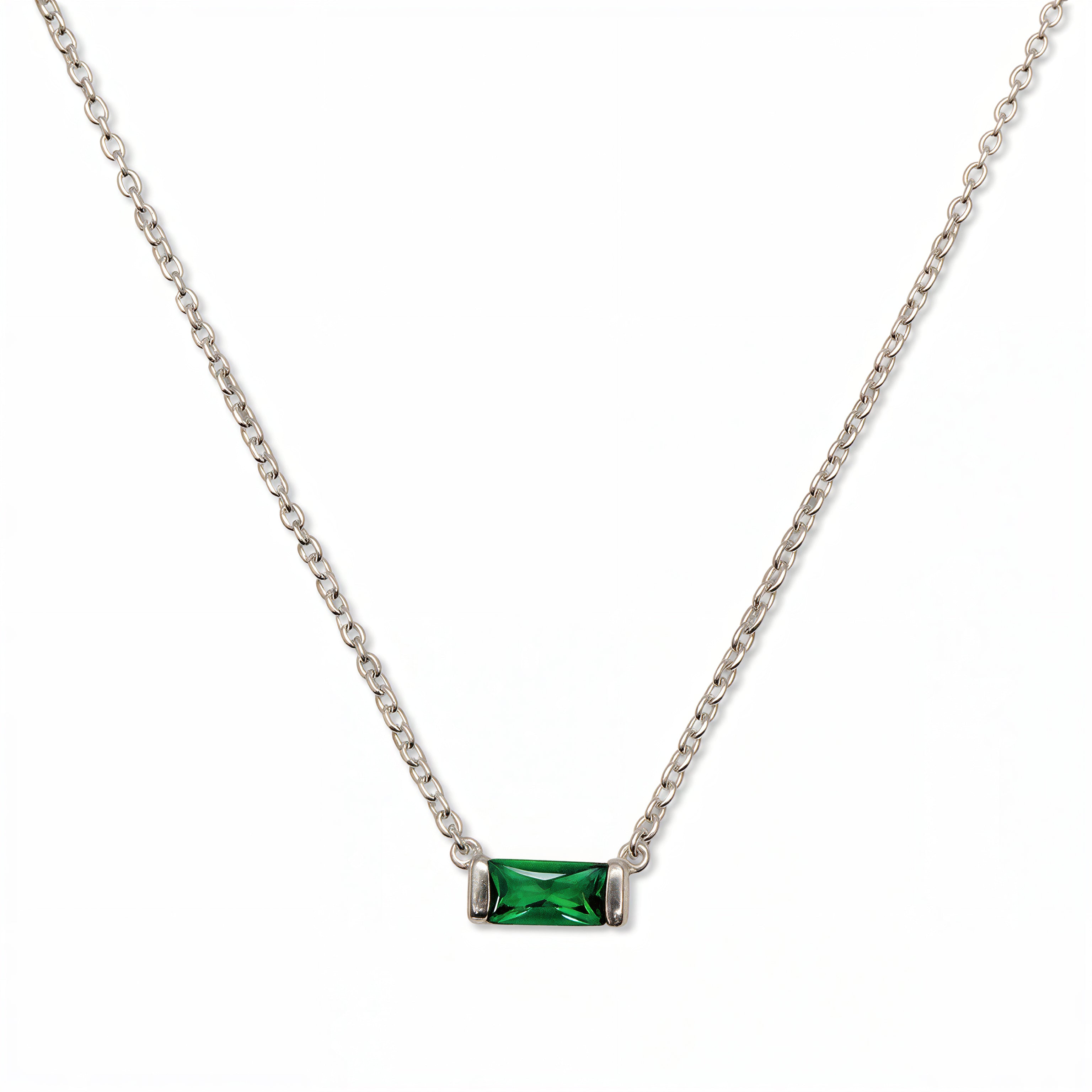 A May Birthstone Emerald Cubic Zirconia Baguette Necklace by Skōsh Jewelry, featuring a slim rectangular green baguette stone set horizontally on a fine sterling silver chain, displayed against a white background.