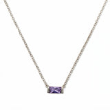 A June Birthstone Lavender Cubic Zirconia Baguette Necklace by Skōsh Jewelry, featuring a slim rectangular light purple baguette stone set horizontally on a fine sterling silver chain, displayed against a white background.
