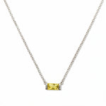 A November Birthstone Citrine Cubic Zirconia Baguette Necklace by Skōsh Jewelry, featuring a slim rectangular yellow baguette stone set horizontally on a fine sterling silver chain, displayed against a white background.