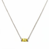 A November Birthstone Citrine Cubic Zirconia Baguette Necklace by Skōsh Jewelry, featuring a slim rectangular yellow baguette stone set horizontally on a fine sterling silver chain, displayed against a white background.