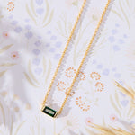 May Birthstone Emerald Cubic Zirconia Baguette Necklace in 14K gold over sterling silver by Skōsh Jewelry