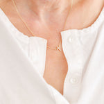 Endless Faith Mini Cross with White Cubic Zirconia Necklace in 14K gold over sterling silver by Skōsh Jewelry