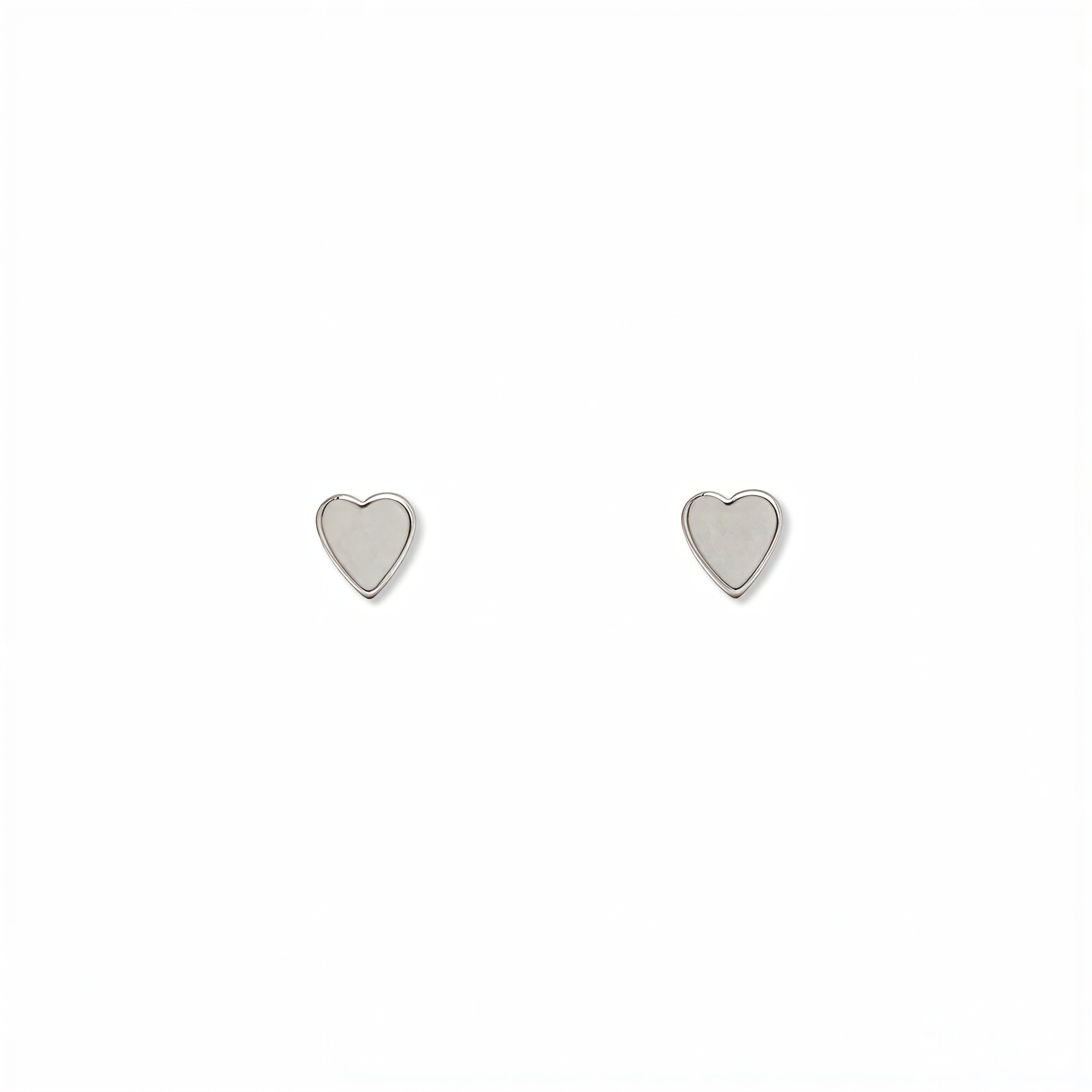 A pair of Polished Mini Heart Stud Earrings by Skōsh Jewelry, featuring tiny heart-shaped studs in sterling silver, displayed against a white background.