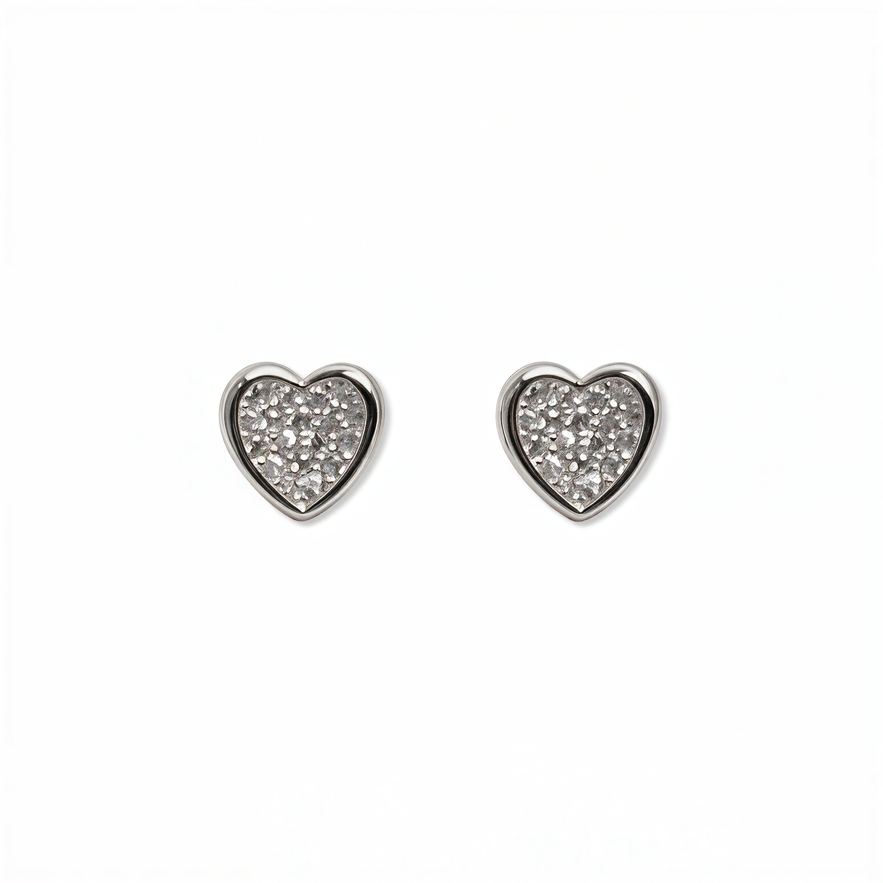 A pair of White Cubic Zirconia Pavé Heart Stud Earrings by Skōsh Jewelry, featuring heart-shaped studs covered in small clear pavé stones set in sterling silver, displayed against a white background.