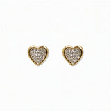 A pair of White Cubic Zirconia Pavé Heart Stud Earrings by Skōsh Jewelry, featuring heart-shaped studs covered in small clear pavé stones set in gold, displayed against a white background.