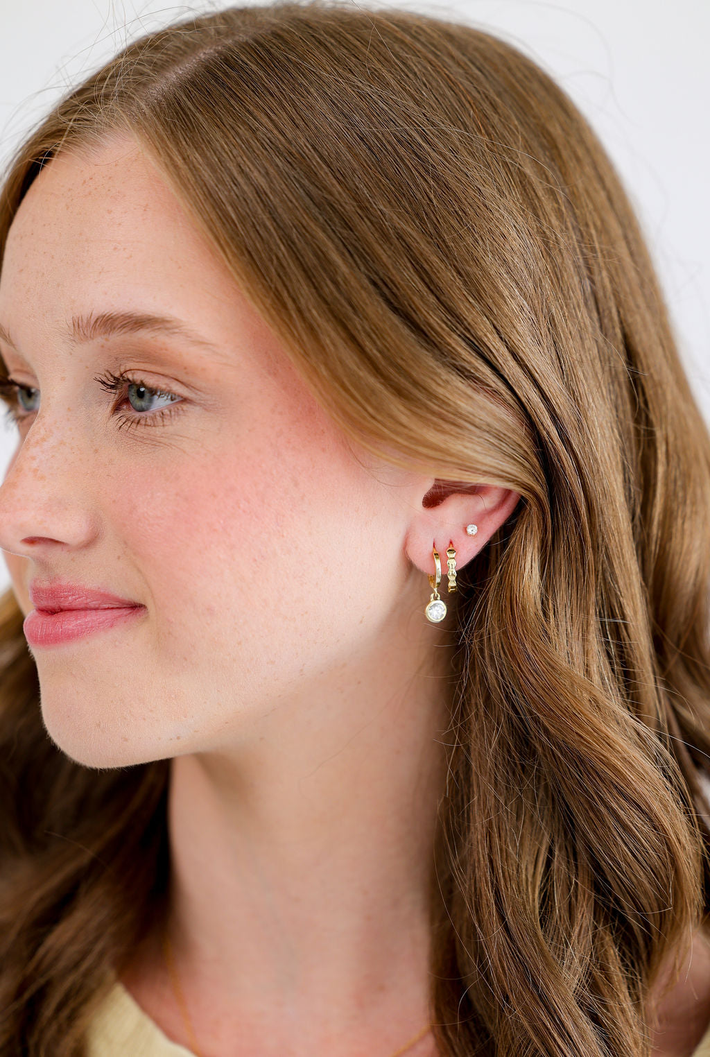 Bezel Set White Cubic Zirconia Drop Huggie Hoop Earrings in 14K gold over sterling silver by Skōsh Jewelry