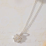 Snowflake Pendant with White Cubic Zirconia Accent Necklace in sterling silver by Skōsh Jewelry