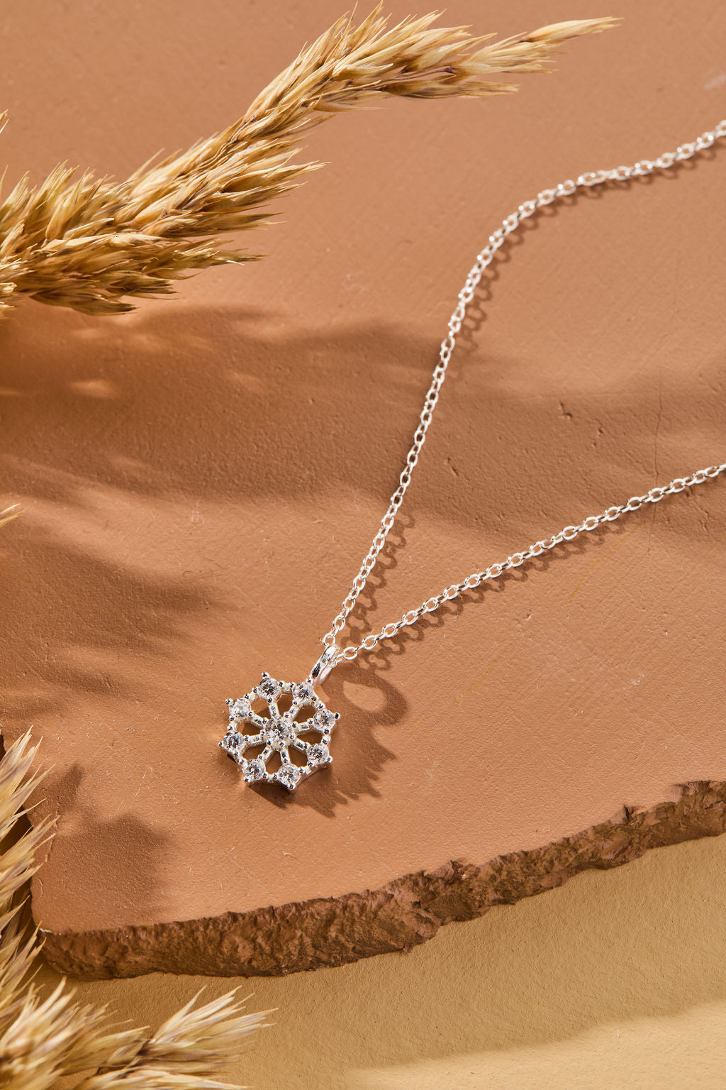 Snowflake Pendant with White Cubic Zirconia Accent Necklace in sterling silver by Skōsh Jewelry