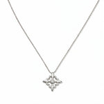 A Louisiana Fleur-de-lis with White Cubic Zirconia Accent Pendant Necklace by Skōsh Jewelry, featuring a fleur-de-lis cross with a small clear stone at its center on a fine sterling silver chain, displayed against a white background.