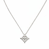 A Louisiana Fleur-de-lis with White Cubic Zirconia Accent Pendant Necklace by Skōsh Jewelry, featuring a fleur-de-lis cross with a small clear stone at its center on a fine sterling silver chain, displayed against a white background.