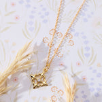Louisiana Fleur-de-lis with White Cubic Zirconia Accent Pendant Necklace in 14K gold over sterling silver by Skōsh Jewelry