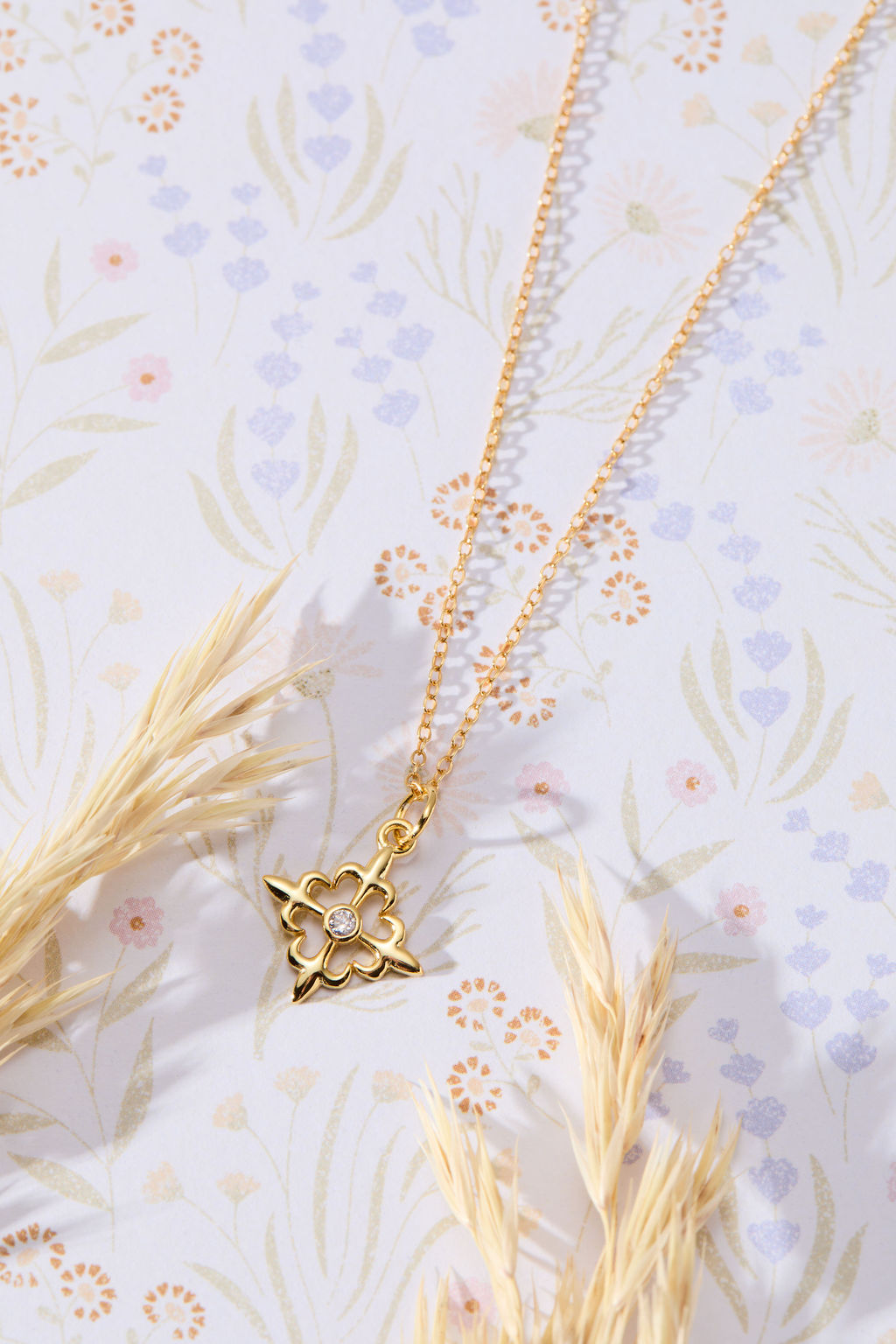 Louisiana Fleur-de-lis with White Cubic Zirconia Accent Pendant Necklace in 14K gold over sterling silver by Skōsh Jewelry