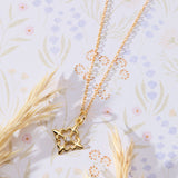 Louisiana Fleur-de-lis with White Cubic Zirconia Accent Pendant Necklace in 14K gold over sterling silver by Skōsh Jewelry