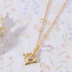 Louisiana Fleur-de-lis with White Cubic Zirconia Accent Pendant Necklace in 14K gold over sterling silver by Skōsh Jewelry