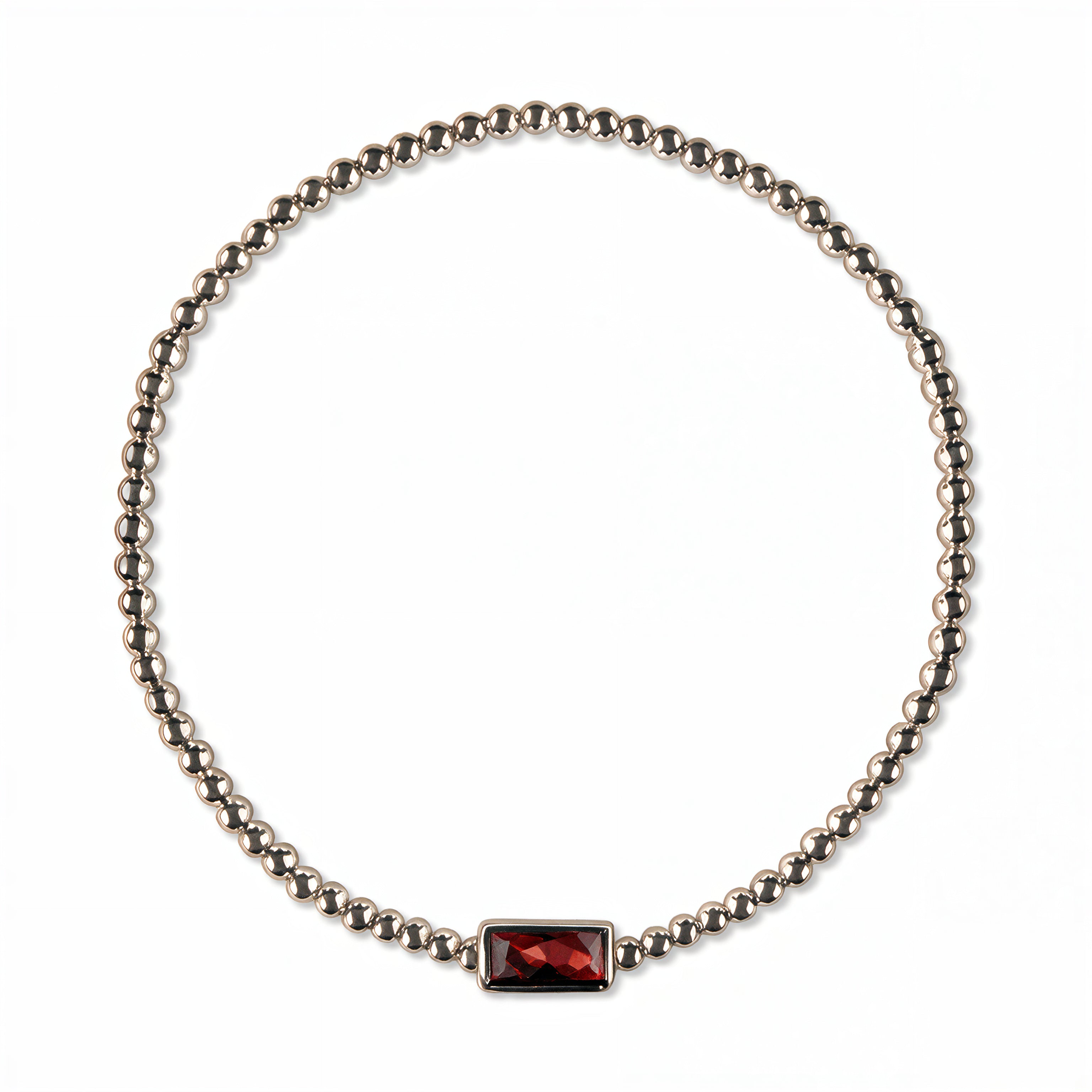 A January Birthstone Garnet Cubic Zirconia Baguette Bracelet by Skōsh Jewelry, featuring a strand of polished sterling silver beads on a stretch cord with a rectangular deep red baguette stone at the center, displayed against a white background.