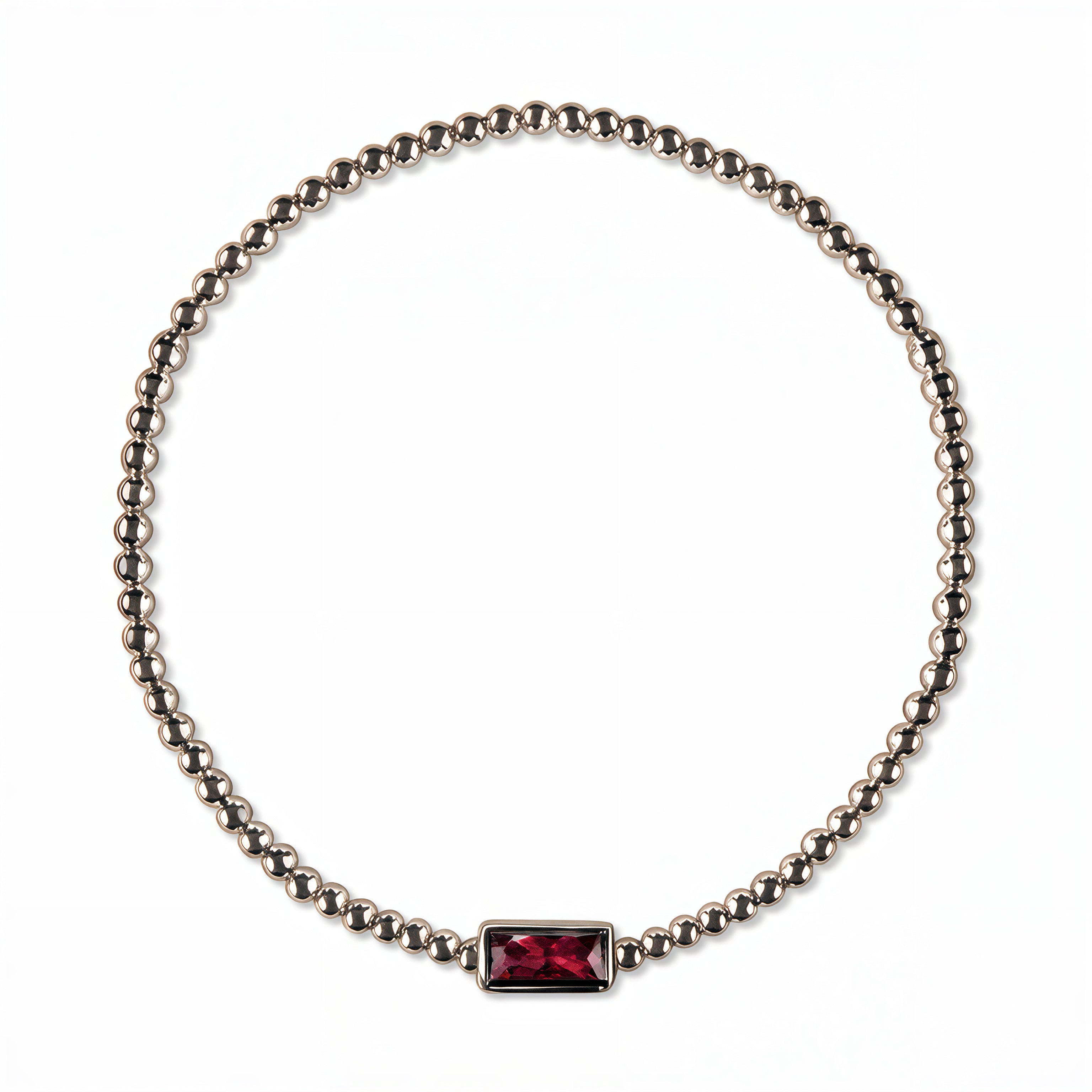 A July Birthstone Ruby Cubic Zirconia Baguette Bracelet by Skōsh Jewelry, featuring a strand of polished sterling silver beads on a stretch cord with a rectangular red baguette stone at the center, displayed against a white background.