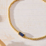 September Birthstone Sapphire Cubic Zirconia Baguette Bracelet in 14K gold over sterling silver by Skōsh Jewelry