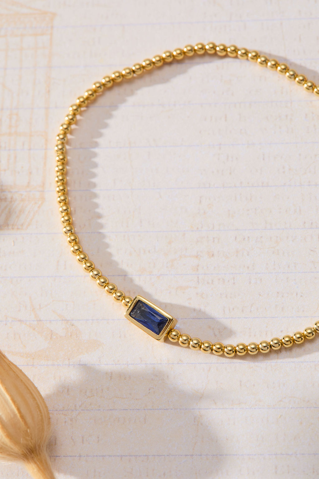 September Birthstone Sapphire Cubic Zirconia Baguette Bracelet in 14K gold over sterling silver by Skōsh Jewelry