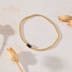 September Birthstone Sapphire Cubic Zirconia Baguette Bracelet in 14K gold over sterling silver by Skōsh Jewelry