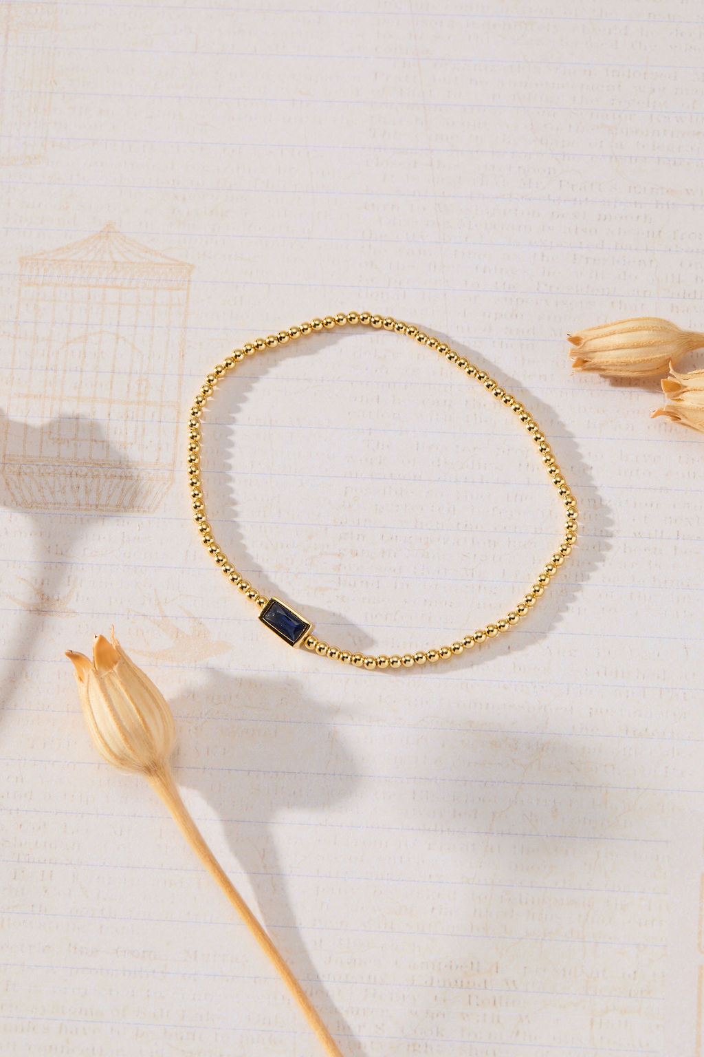 September Birthstone Sapphire Cubic Zirconia Baguette Bracelet in 14K gold over sterling silver by Skōsh Jewelry