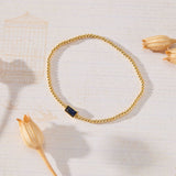 September Birthstone Sapphire Cubic Zirconia Baguette Bracelet in 14K gold over sterling silver by Skōsh Jewelry