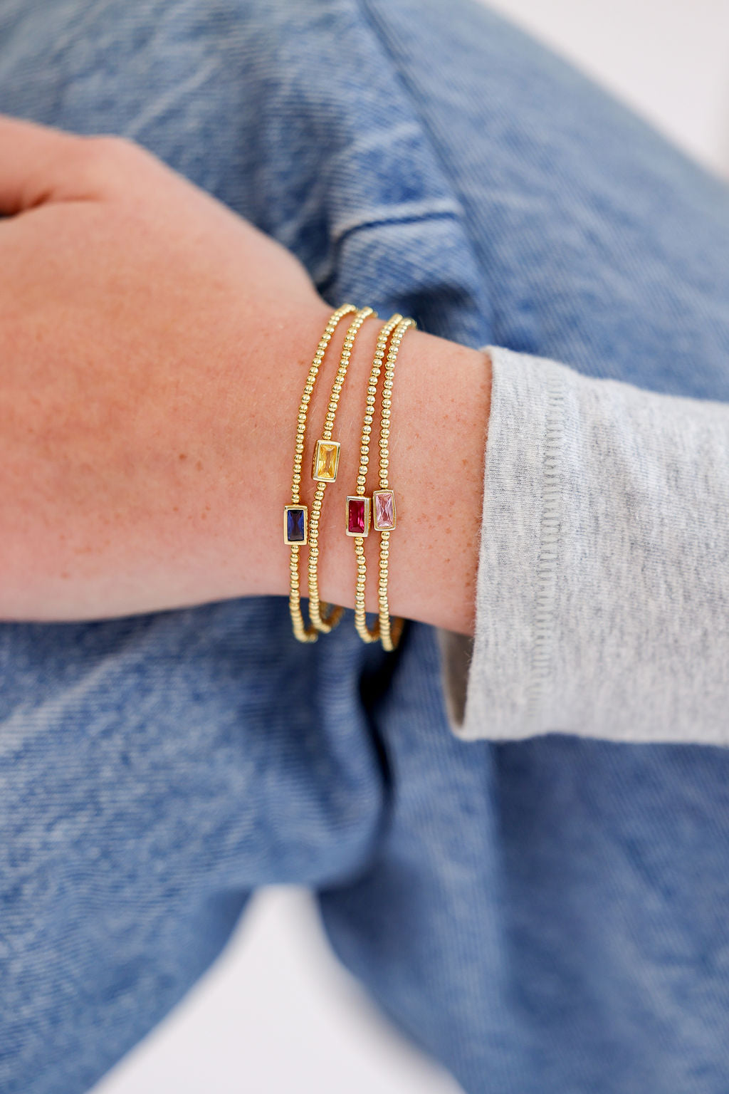 Birthstone Cubic Zirconia Baguette Bracelets in 14K gold over sterling silver by Skōsh Jewelry