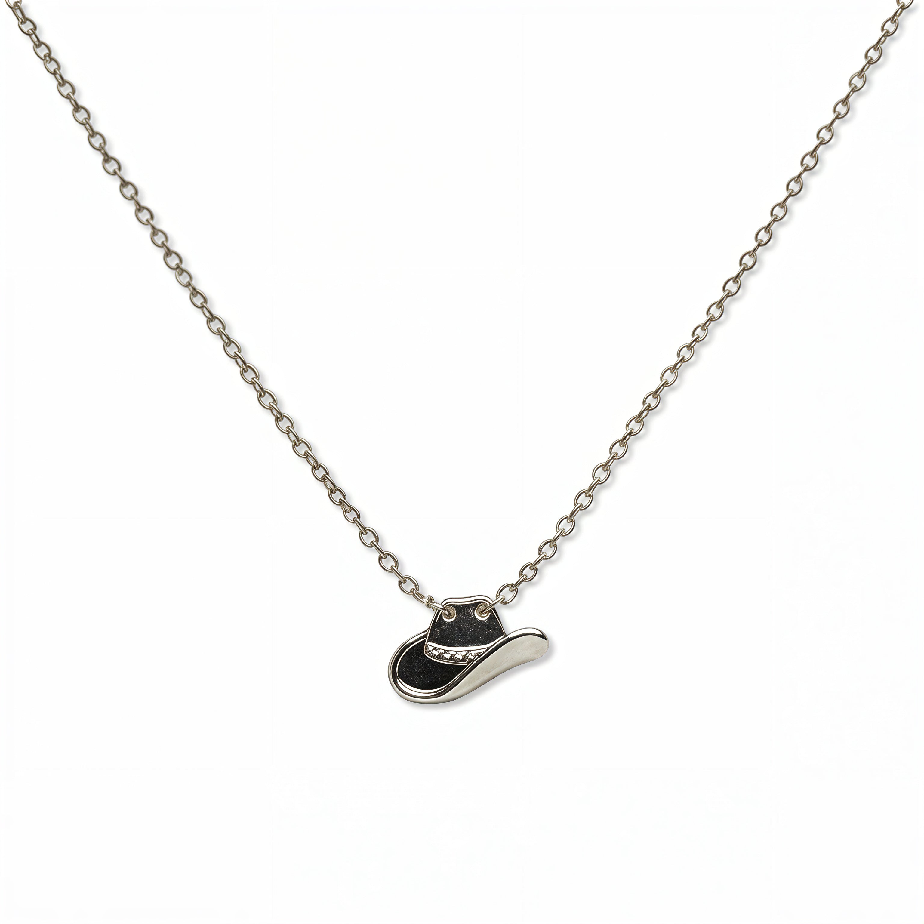 A Cowgirl Hat Pendant Necklace by Skōsh Jewelry, featuring a small cowgirl hat pendant on a fine sterling silver chain, displayed against a white background.