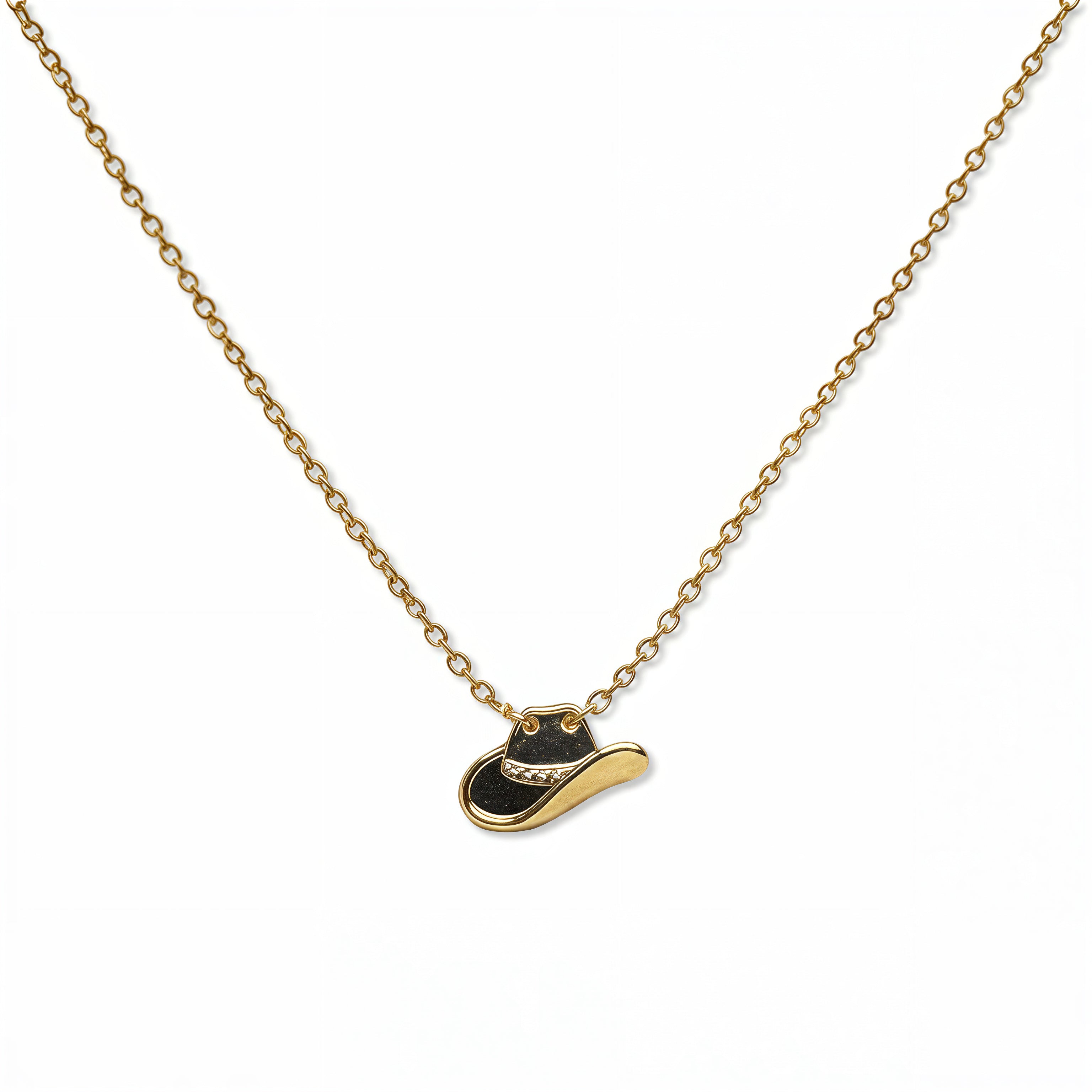 A Cowgirl Hat Pendant Necklace by Skōsh Jewelry, featuring a small cowgirl hat pendant on a fine gold chain, displayed against a white background.