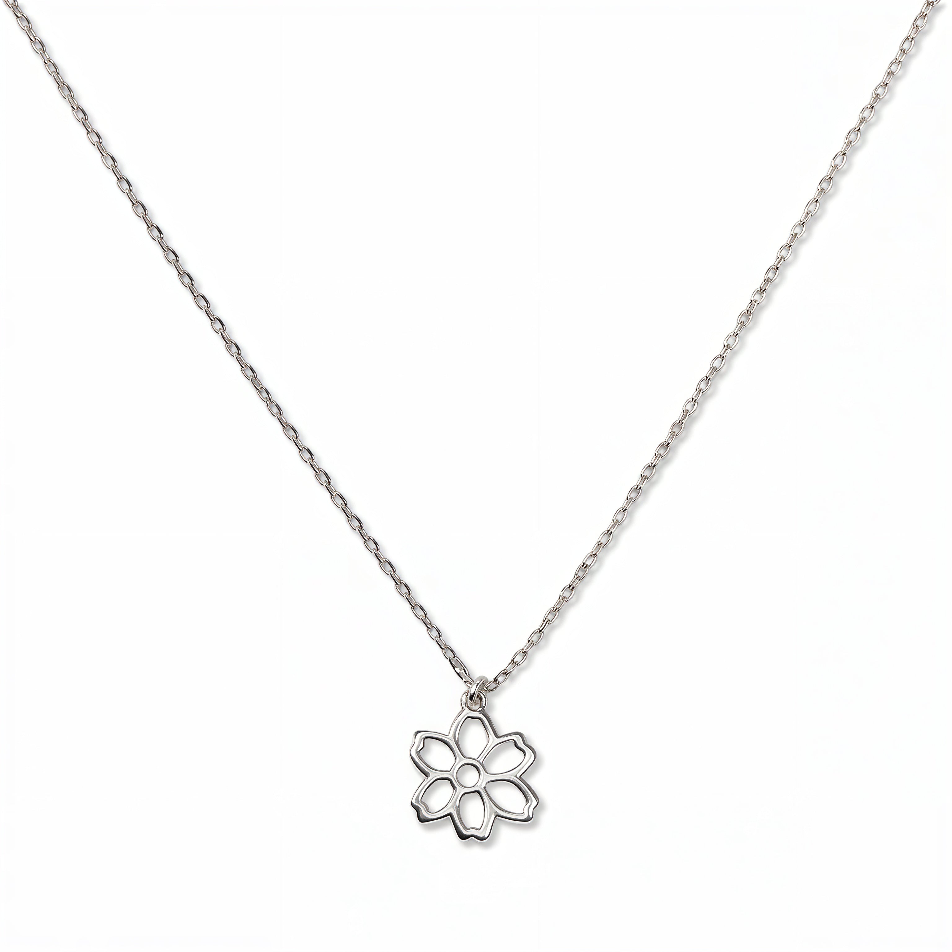 A Carnation January Flower Pendant Necklace by Skōsh Jewelry, featuring an open cutout carnation flower pendant on a fine sterling silver chain, displayed against a white background.