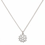 A Poinsettia December Flower Pendant Necklace by Skōsh Jewelry, featuring an open cutout poinsettia flower pendant on a fine sterling silver chain, displayed against a white background.