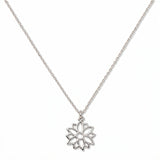 A Poinsettia December Flower Pendant Necklace by Skōsh Jewelry, featuring an open cutout poinsettia flower pendant on a fine sterling silver chain, displayed against a white background.