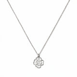 A Violet February Flower Pendant Necklace by Skōsh Jewelry, featuring an open cutout violet flower pendant on a fine sterling silver chain, displayed against a white background.
