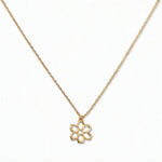 A Carnation January Flower Pendant Necklace by Skōsh Jewelry, featuring an open cutout carnation flower pendant on a fine gold chain, displayed against a white background.