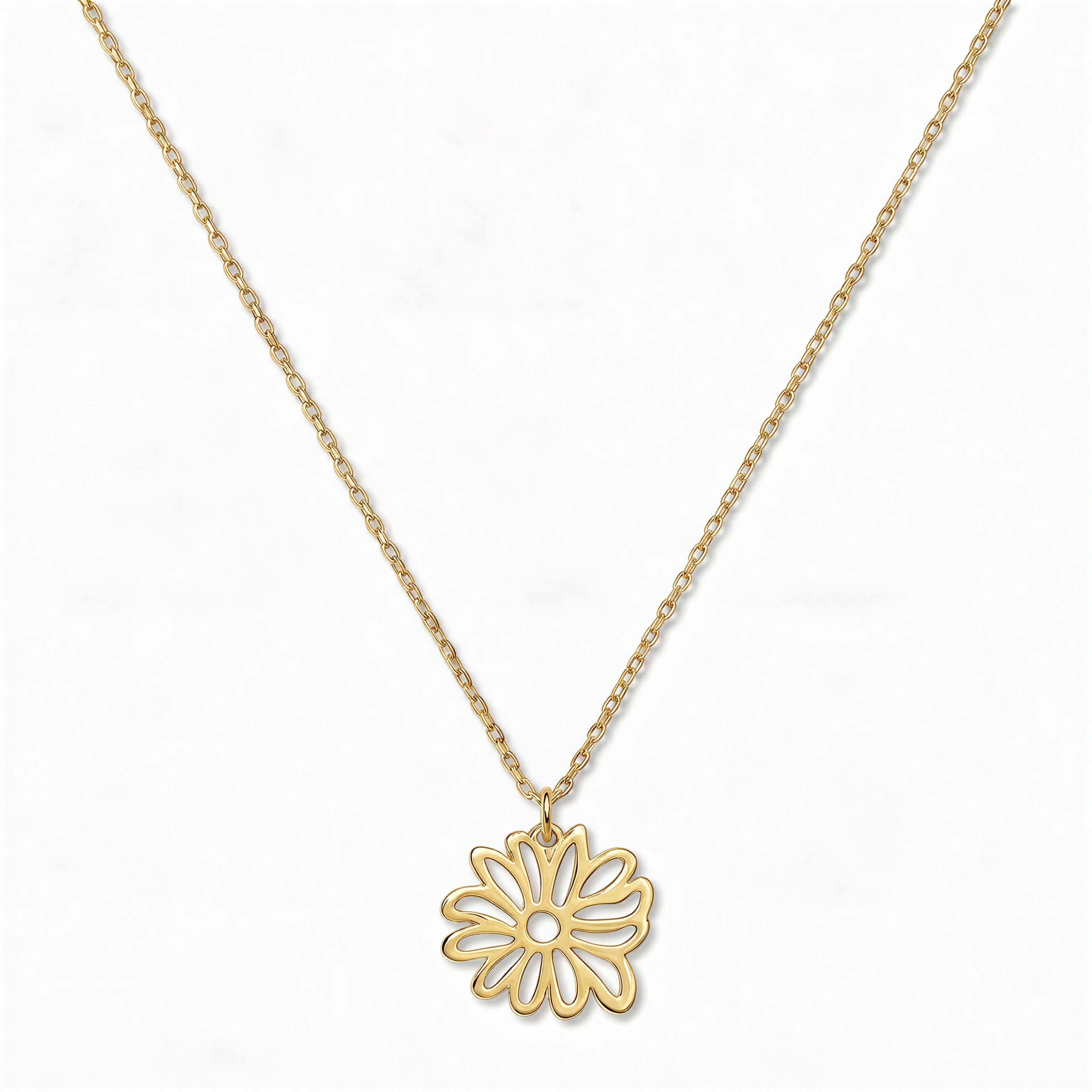 A Chrysanthemum November Flower Pendant Necklace by Skōsh Jewelry, featuring an open cutout chrysanthemum flower pendant on a fine gold chain, displayed against a white background.