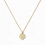 A Violet February Flower Pendant Necklace by Skōsh Jewelry, featuring an open cutout violet flower pendant on a fine gold chain, displayed against a white background.
