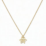 A Daffodil March Flower Pendant Necklace by Skōsh Jewelry, featuring an open cutout daffodil flower pendant on a fine gold chain, displayed against a white background.