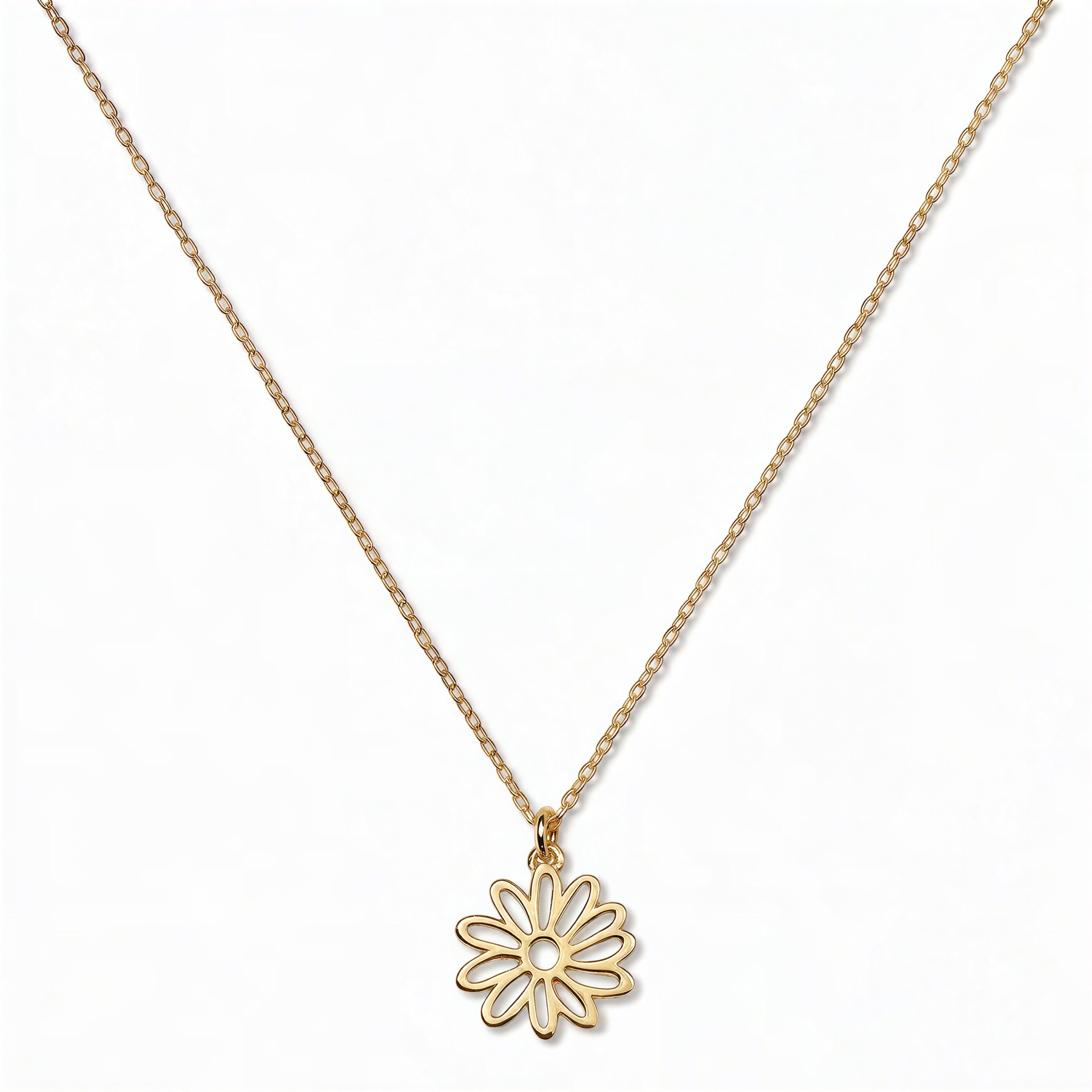 A Daisy April Flower Pendant Necklace by Skōsh Jewelry, featuring an open cutout daisy flower pendant on a fine gold chain, displayed against a white background.